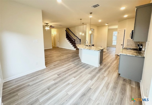 carpeted empty room with ceiling fan and vaulted ceiling