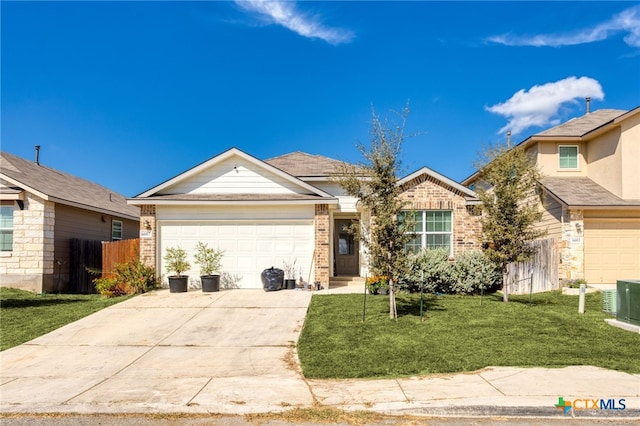 view of front facade featuring a garage, a front yard, and central AC