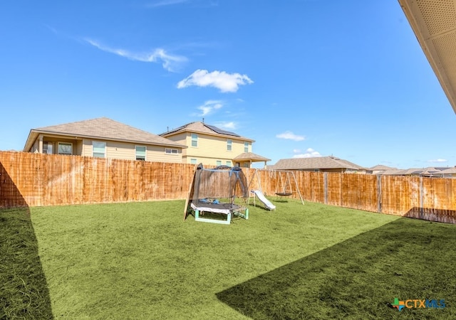 view of yard featuring a trampoline