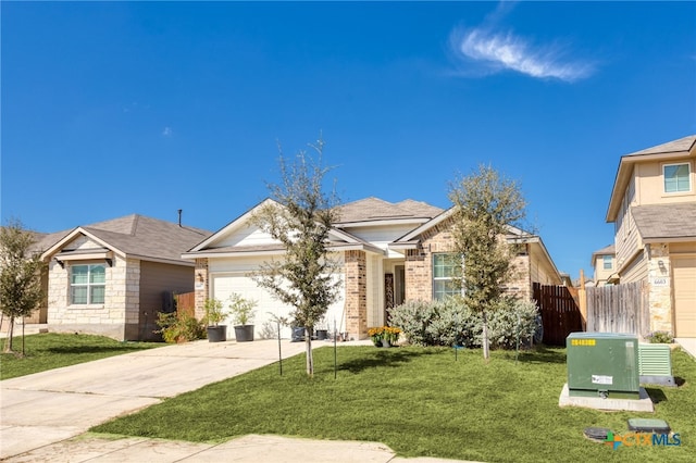 view of front of house with a garage and a front yard