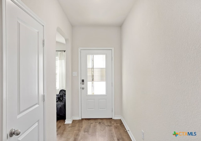 doorway to outside with light hardwood / wood-style flooring