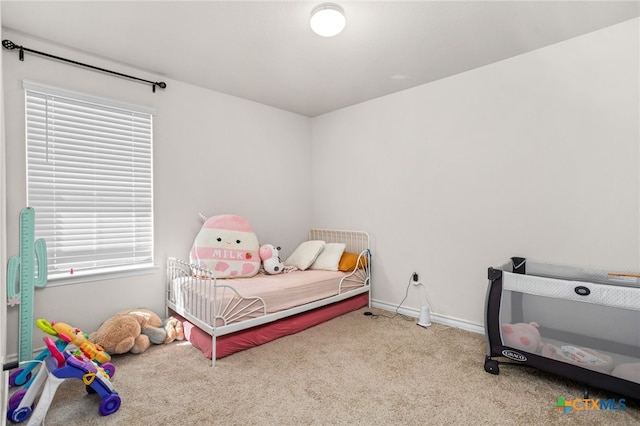 bedroom with light colored carpet