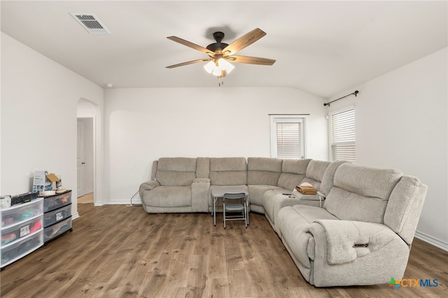 living room with lofted ceiling, wood-type flooring, and ceiling fan