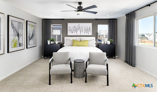 carpeted bedroom with ceiling fan