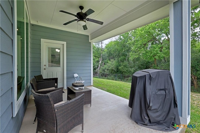 view of patio with ceiling fan, fence, and area for grilling