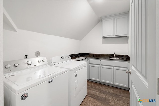 laundry room featuring wet bar, independent washer and dryer, cabinet space, a sink, and dark wood-style floors