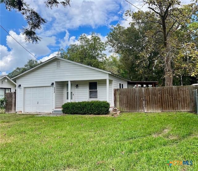 view of front facade with a garage and a front yard