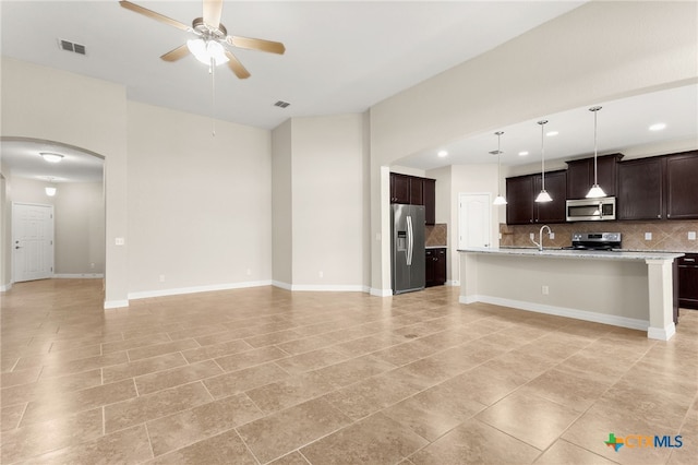 730 Stratus Path, New Braunfels, TX 78130 - unfurnished living room with ceiling fan, arched walkways, and recessed lighting