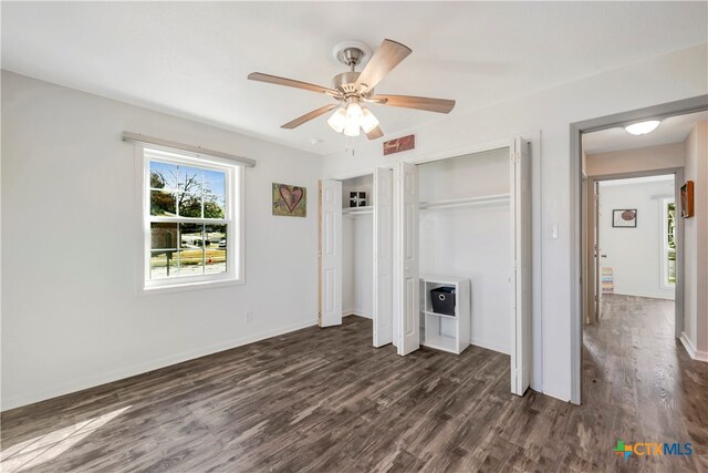 unfurnished bedroom with dark hardwood / wood-style floors and ceiling fan