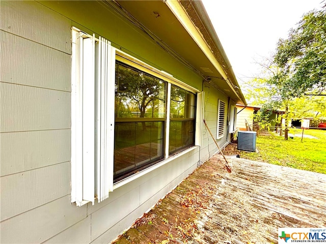 exterior space featuring a lawn, central AC, and a patio area