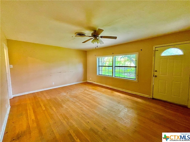 foyer with hardwood / wood-style flooring and ceiling fan