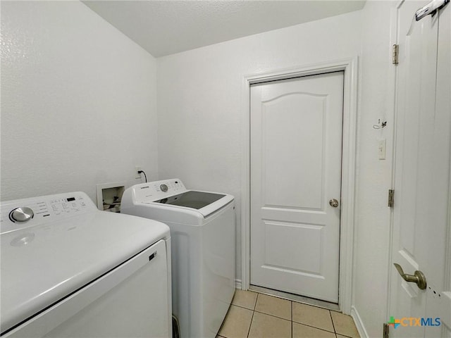 408 Rowdy Dr, Killeen, TX 76542 - laundry room with washer and dryer and light tile patterned flooring