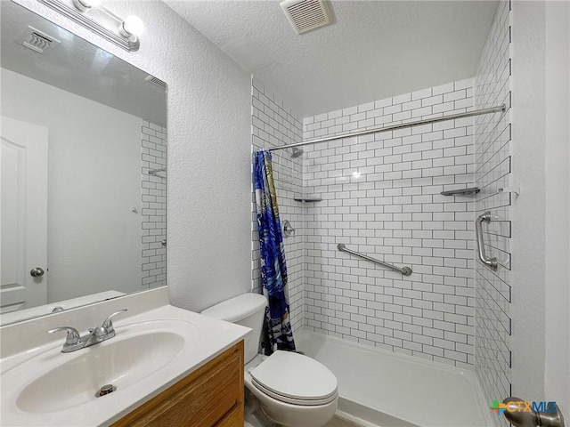408 Rowdy Dr, Killeen, TX 76542 - bathroom with a shower stall, vanity, a textured wall, and a textured ceiling