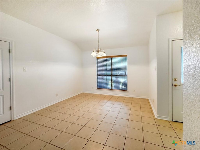 408 Rowdy Dr, Killeen, TX 76542 - spare room with light tile patterned flooring, a chandelier, and lofted ceiling
