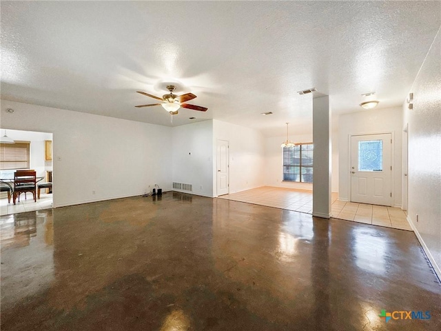 408 Rowdy Dr, Killeen, TX 76542 - unfurnished living room featuring concrete flooring, a ceiling fan, and a textured ceiling