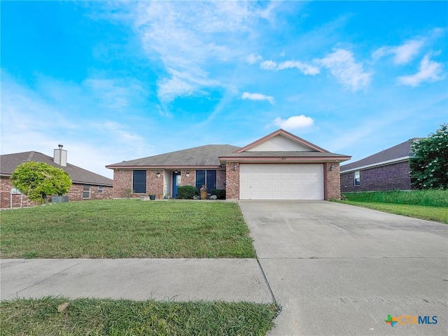 408 Rowdy Dr, Killeen, TX 76542 - ranch-style house with brick siding, an attached garage, driveway, and a front yard