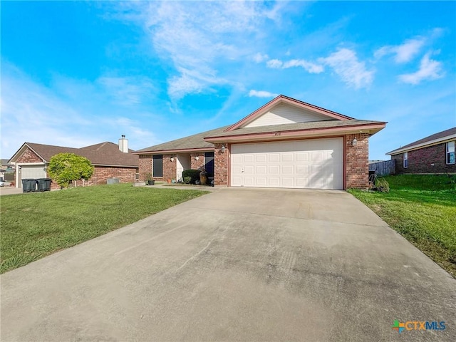 408 Rowdy Dr, Killeen, TX 76542 - ranch-style house featuring brick siding, a front yard, and driveway