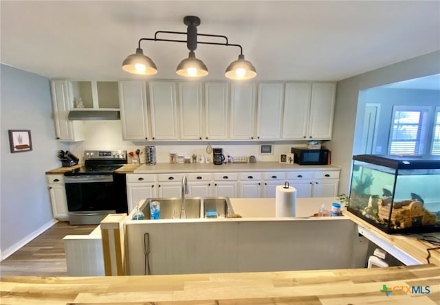 kitchen featuring sink, hanging light fixtures, white cabinetry, and stainless steel electric range