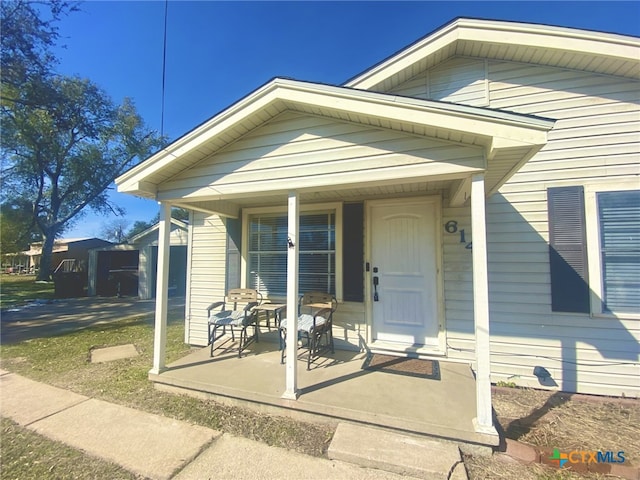 property entrance featuring covered porch