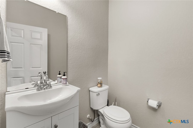 135 Mary Max Cir, San Marcos, TX 78666 - half bath featuring toilet, vanity, and a textured wall