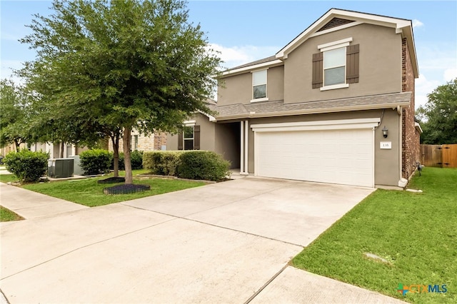 135 Mary Max Cir, San Marcos, TX 78666 - view of front of property with stucco siding, a garage, concrete driveway, and central AC unit