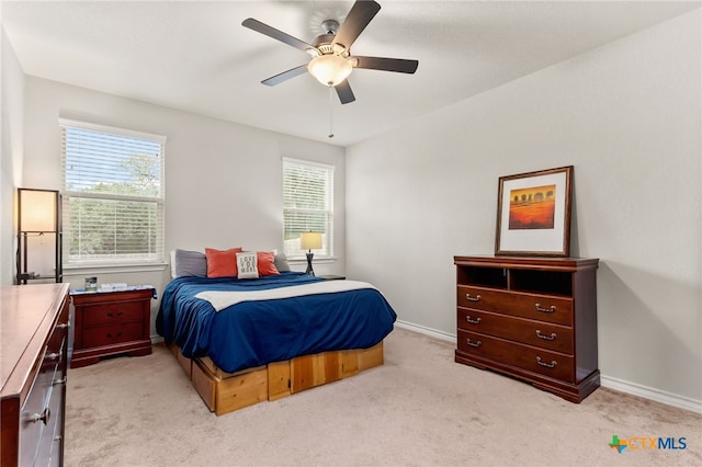 135 Mary Max Cir, San Marcos, TX 78666 - bedroom featuring light carpet, baseboards, and ceiling fan