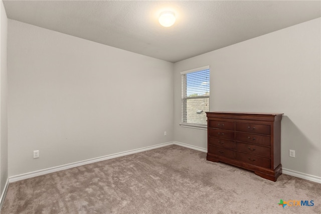 135 Mary Max Cir, San Marcos, TX 78666 - unfurnished bedroom with baseboards and carpet floors