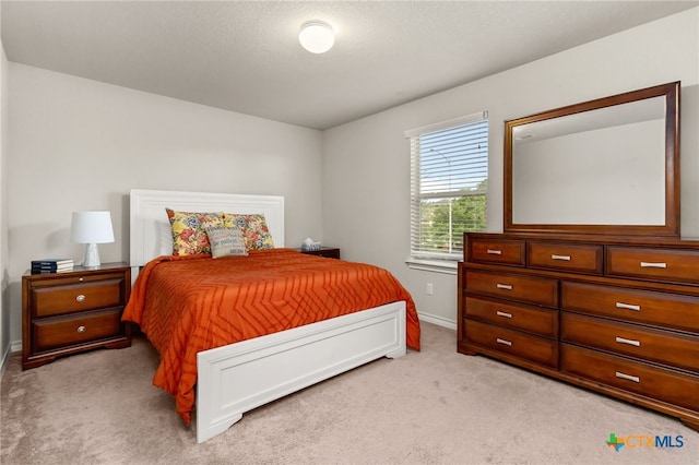 135 Mary Max Cir, San Marcos, TX 78666 - bedroom with light colored carpet and baseboards