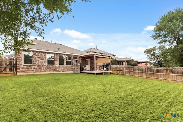 135 Mary Max Cir, San Marcos, TX 78666 - rear view of property with brick siding, a deck, and roof with shingles