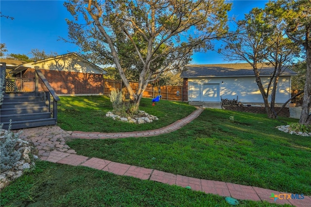 view of yard with a wooden deck