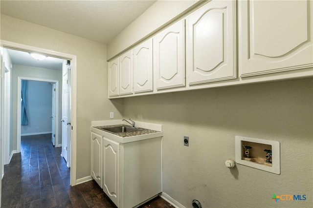 laundry area featuring hookup for an electric dryer, dark hardwood / wood-style flooring, cabinets, sink, and washer hookup