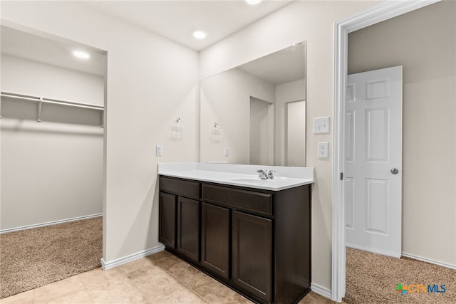 bathroom with tile patterned flooring and vanity