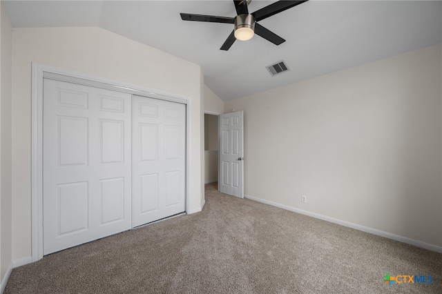 907 Pecos Cv, Leander, TX 78641 - unfurnished bedroom featuring vaulted ceiling, carpet floors, a closet, baseboards, and ceiling fan