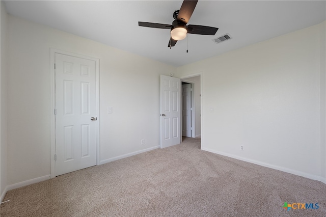 907 Pecos Cv, Leander, TX 78641 - unfurnished bedroom with carpet flooring, baseboards, and ceiling fan