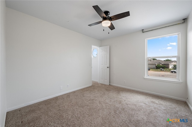 907 Pecos Cv, Leander, TX 78641 - carpeted empty room with baseboards and a ceiling fan