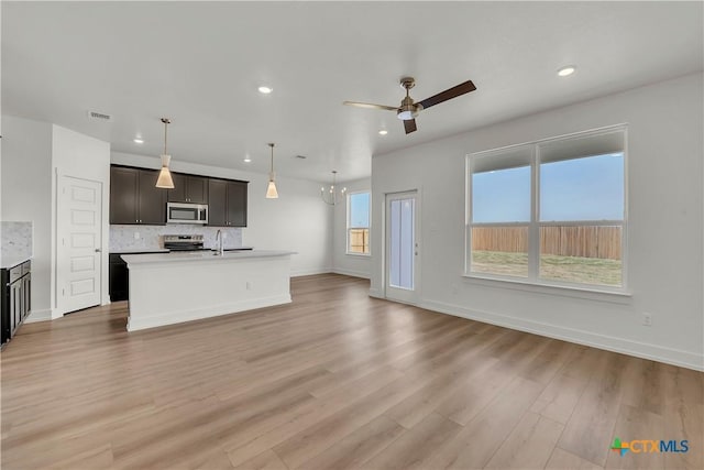 2322 Healy Dr, Temple, TX 76502 - kitchen featuring appliances with stainless steel finishes, backsplash, recessed lighting, light wood-type flooring, and a ceiling fan
