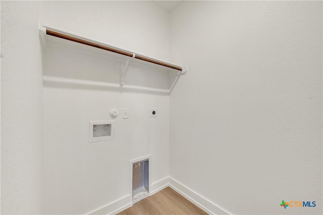 2322 Healy Dr, Temple, TX 76502 - washroom featuring electric dryer hookup, light wood finished floors, hookup for a gas dryer, and hookup for a washing machine