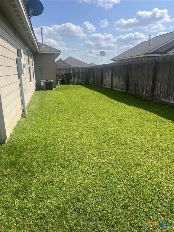 906 2nd St, Cuero, TX 77954 - view of yard with central AC unit