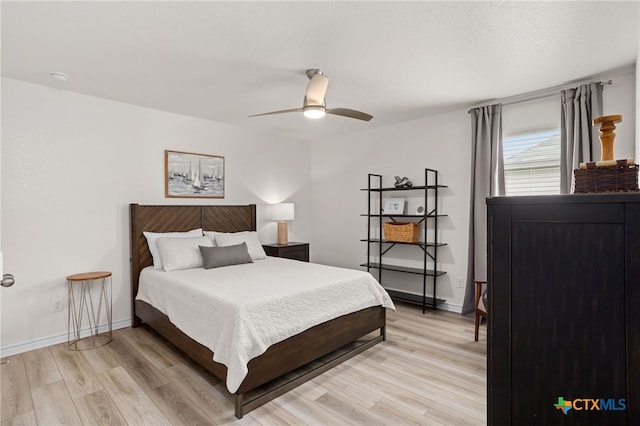 507 Dakota Crk, New Braunfels, TX 78130 - bedroom with light wood-type flooring, ceiling fan, and baseboards