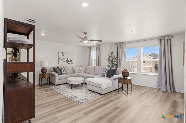 507 Dakota Crk, New Braunfels, TX 78130 - living area featuring light wood-style floors, ceiling fan, baseboards, and recessed lighting