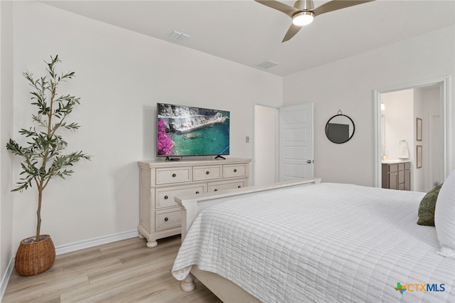 507 Dakota Crk, New Braunfels, TX 78130 - bedroom featuring light wood finished floors, baseboards, ensuite bath, and a ceiling fan
