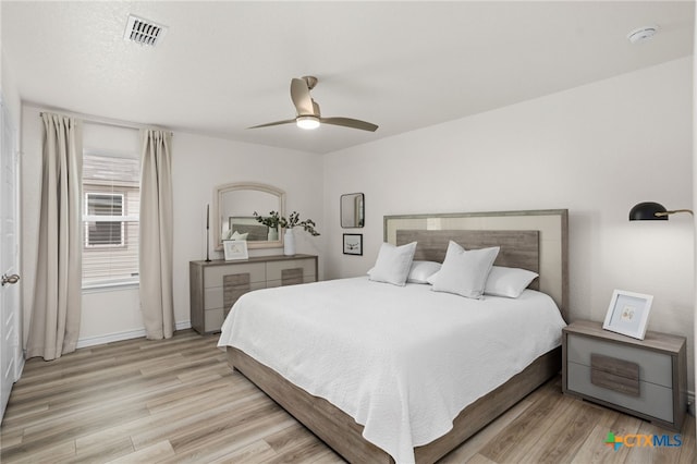 507 Dakota Crk, New Braunfels, TX 78130 - bedroom featuring wood finished floors, a ceiling fan, and baseboards