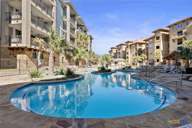 view of swimming pool with a patio