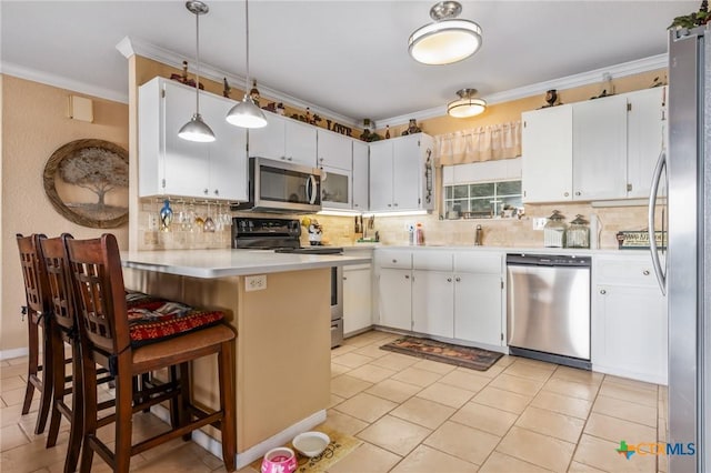 3735 Smoke Signal Rd, Belton, TX 76513 - kitchen with appliances with stainless steel finishes, crown molding, a peninsula, tasteful backsplash, and light countertops