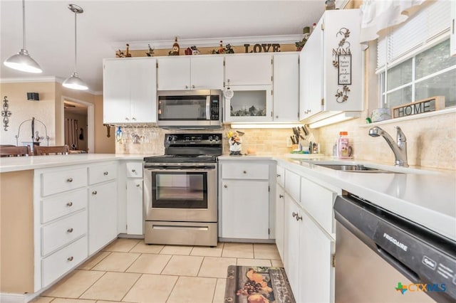 3735 Smoke Signal Rd, Belton, TX 76513 - kitchen with stainless steel appliances, crown molding, decorative backsplash, light tile patterned floors, and light countertops