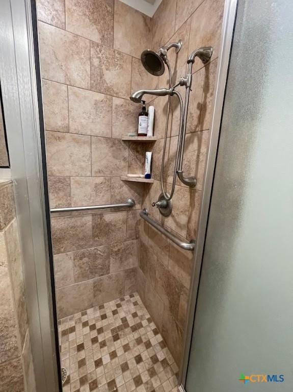 full bathroom with a shower stall