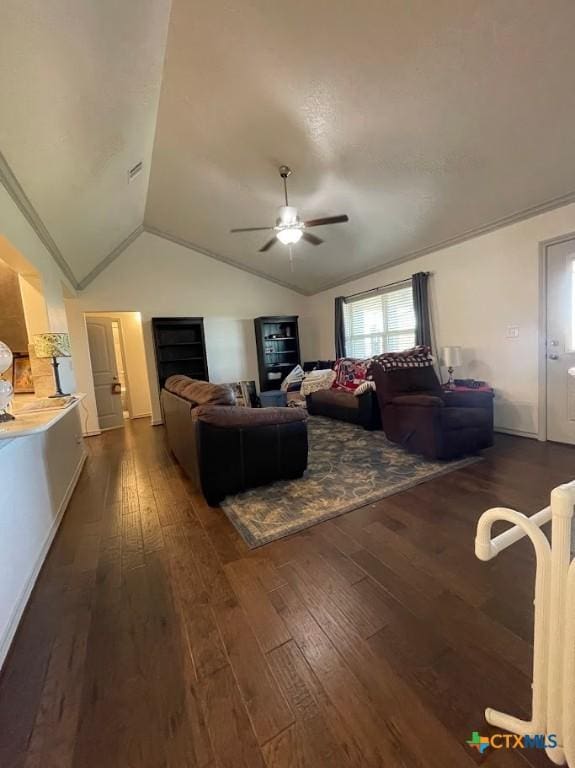 living room featuring dark wood-style flooring, ceiling fan, and vaulted ceiling