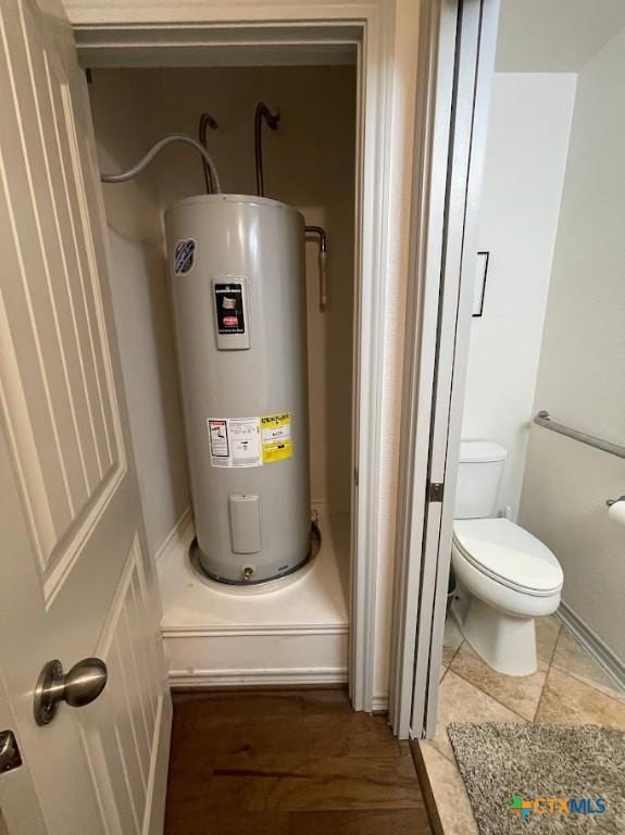 utility room featuring electric water heater