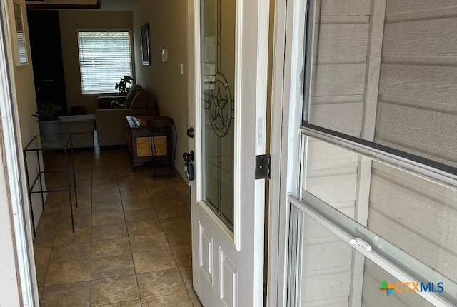 interior space with dark tile patterned flooring