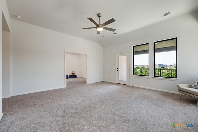 interior space with light carpet and ceiling fan